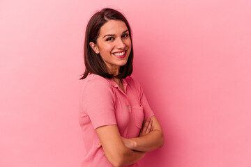 Fototapeta premium Young caucasian woman isolated on pink background laughing and having fun.