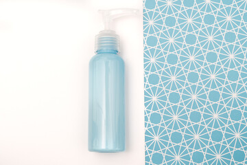 creative concept of blue jars of cosmetics on an interesting geometric background