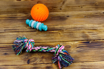 Dog's toys on a wooden background