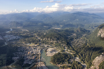 Aerial View from Airplane of a small touristic town, Squamish. Sunny Summer. Located in Howe Sound, North of Vancouver, British Columbia, Canada.