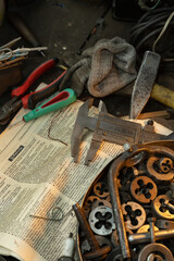 caliper garage old tool on the workbench stand wheel wrenches screwdriver