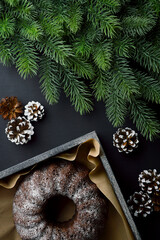 Bakery background. Christmas pastries. Fragrant cupcake and branches of a Christmas tree. Top view. Flat lay .Copy space