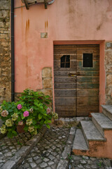 Fototapeta na wymiar The door of an old house in Maenza, a medieval town in the Lazio region, Italy.