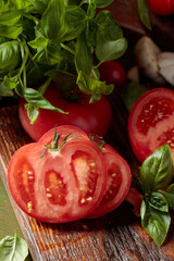 Ripe red tomatoes with basil and garlic.