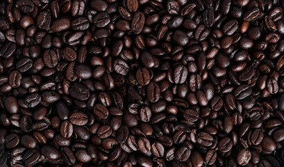 Fototapeta premium Coffee beans background. Coffee beans heap. Coffee.