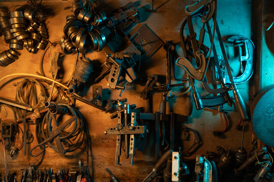 A lot of old rusty instruments in vintage dirty garage - Powered by Adobe