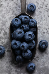 Fresh blueberries in a old spoon, macro