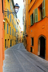 Fototapeta na wymiar Vibrant narrow street in the French Riviera town of Menton