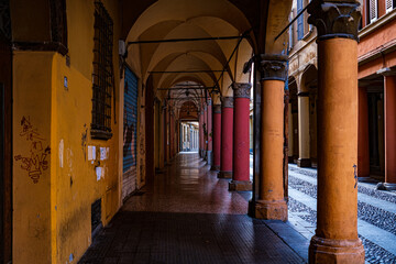 Porticoes of Bologna by day. Arches, columns, architecture. Italy - obrazy, fototapety, plakaty