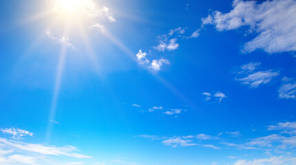 Naklejka na ściany i meble blue sky , sun and beautiful white clouds. Wide photo.