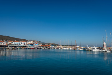 Fototapeta na wymiar ISKELE, URLA, IZMIR, TURKEY. View on marina from the cafe on the pier