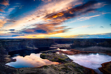 Sunrise over the Grand Coulee and Sun Lakes Dry Falls State Park in Washington State once the...
