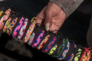 The hands of an old street vendor in Peru
