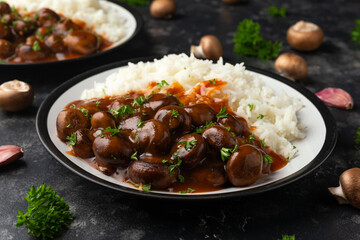 Mushrooms in Balsamic Soy rich sauce with rice. healthy vegan food.