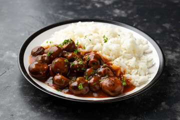 Mushrooms in Balsamic Soy rich sauce with rice. healthy vegan food.