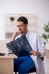 Young male doctor radiologist working in the clinic