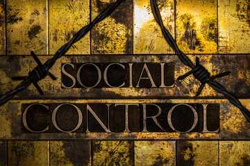 Social Control text formed with real authentic typeset letters on vintage textured silver grunge copper and gold background
