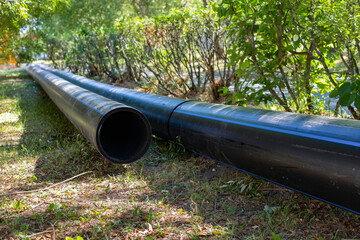 The sewer pipes are lying on the ground.Repair work