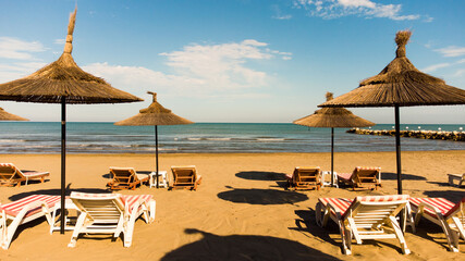 straw umbrellas on the sandy beach