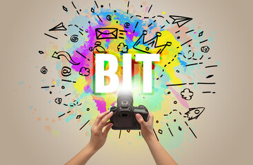 Close-up of a hand holding digital camera with abstract drawing