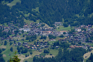 Fototapeta na wymiar Aerial view of mountain village Wengen on a sunny summer day. Photo taken July 20th, 2021, Lauterbrunnen, Switzerland.