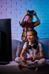 children playing video game with game console