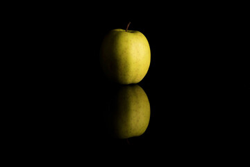 Golden Apple Isolated On A Black Background