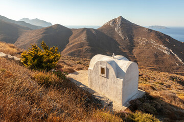 A small church in the rocky landscape of Greek island Anafi in the Cyclades, Greece