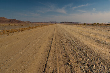 Fototapeta na wymiar Straight Road Through Namib Desert