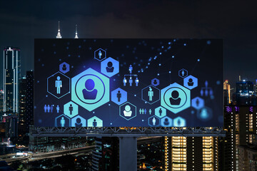 Glowing Social media icons on billboard over night panoramic city view of Kuala Lumpur, Malaysia,...