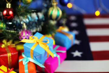 New Year, Christmas presents under the Christmas tree, blurred background, bokeh, place for your text.