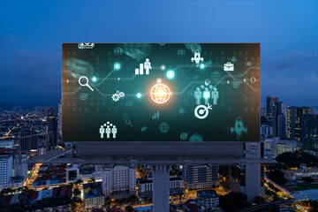 Research and technological development glowing icons on billboard. Night panoramic city view of Kuala Lumpur. Concept of innovative activities expanding new services or products in Malaysia, Asia.
