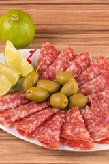 portion of salami on wooden background