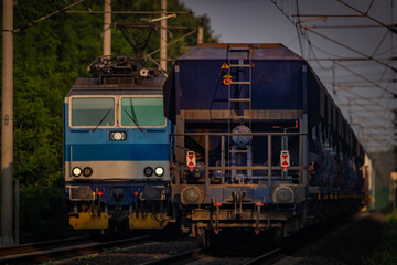 Fototapeta premium Trains and whistle stop Olesko in central Bohemia in sunset orange evening