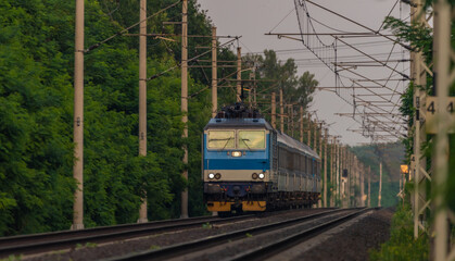 Fototapeta premium Trains and whistle stop Olesko in central Bohemia in sunset orange evening