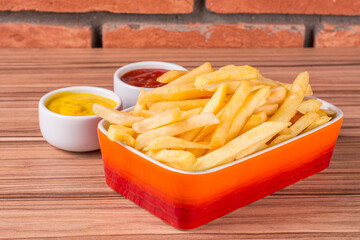 portion of potato chips on wooden background