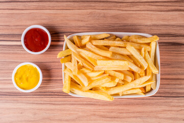 portion of potato chips on wooden background