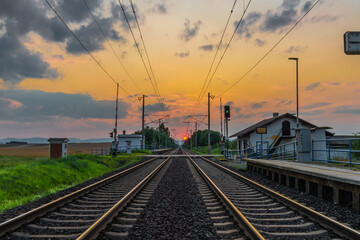 Obraz na płótnie Canvas Trains and whistle stop Olesko in central Bohemia in sunset orange evening