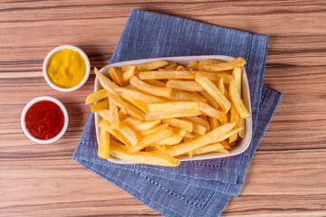 portion of potato chips on wooden background