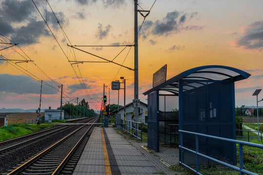 Trains and whistle stop Olesko in central Bohemia in sunset orange evening