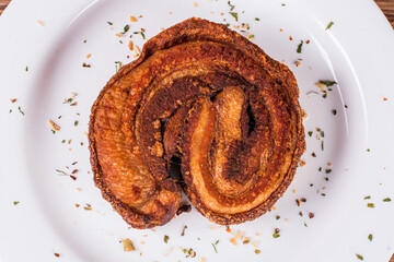 portion of pork cracklings on wooden background