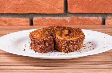 portion of pork cracklings on wooden background