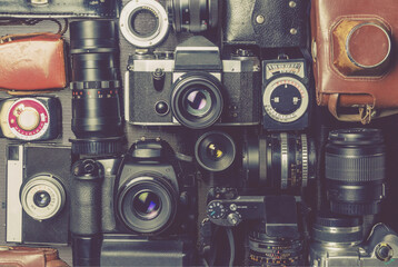 Old outdated cameras, lenses and exposure meters