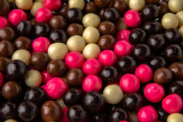 Candies. Glazed hazelnuts or almonds. Desserts for candy bars. Small multicolored dragees.