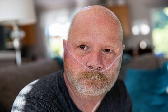 Old Man With Oxygen Tank Hose In Nose Battling Medical Condition In Lungs - Covid-19 Pneumonia