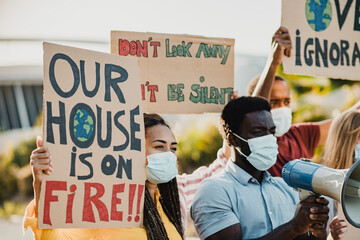 Demonstrators fighting for climate change and pollution during coronavirus outbreak outdoor in the...