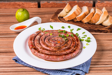 sausage portion with wood and brick background