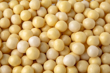 Hazelnuts in white chocolate, dragee. Desserts for Candybar. Small round candies.