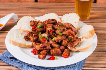 sausage portion with wood and brick background