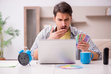 Young male freelancer in time management concept at home